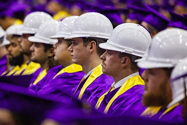 ECU College of Engineering and Technology graduates wear their hard hats during the commencement ceremony